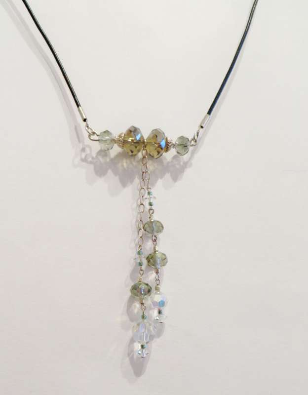 Swarovski and Chinese crystals, silver and leather pendant